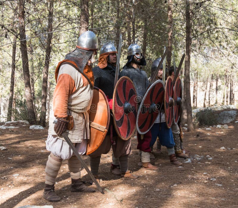 Members of the annual reconstruction of the life of the Vikings - `Viking Village` demonstrate combat formation in the forest near