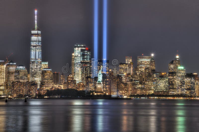 9/11 Memorial Beams with Statue of Liberty Between Them and Lower Manhattan