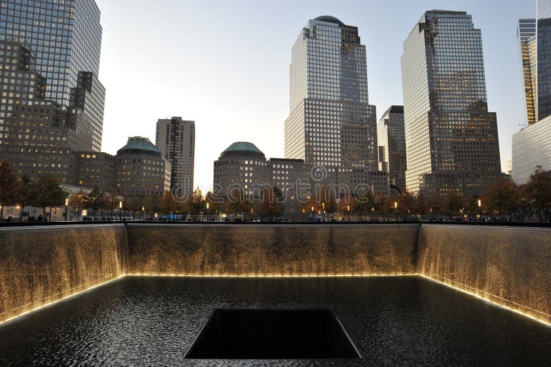 Memorial Pools at National September 11 Memorial. A view of the memorial pools at dusk at the National September 11 Memorial at the World Trade Center site in Memorial Pools at National September 11 Memorial. A view of the memorial pools at dusk at the National September 11 Memorial at the World Trade Center site in