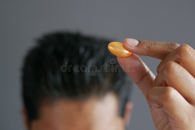 Men Applying Capsule Oil on Hair Stock Photo Image of cosmetic