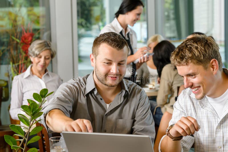 Men business partners working on laptop cafe royalty free stock photography Men business partners working on laptop cafe royalty free stock photography