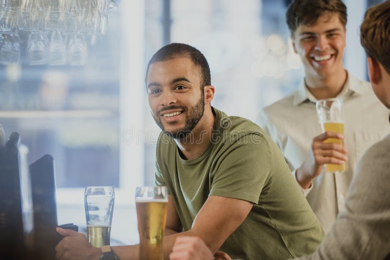 Men Buying Drinks at the Bar Stock Image Image of happiness, casual