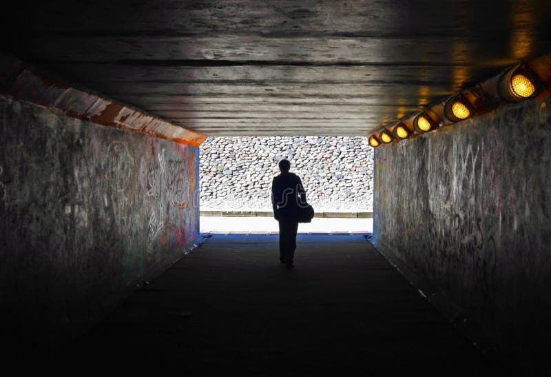 Men in the dark tunnel stock photo Men in the dark tunnel stock photo