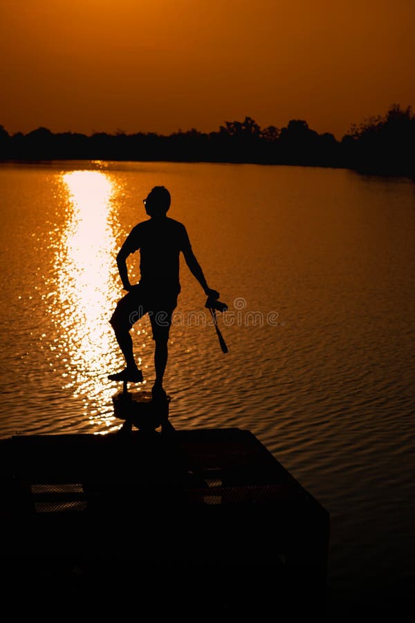 Men are at the edge of the reservoir and View Reservoir In the evening and Sunset stock images Men are at the edge of the reservoir and View Reservoir In the evening and Sunset stock images
