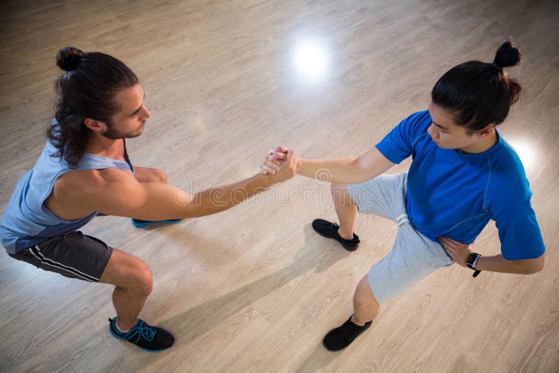 Men exercising in gym editorial stock image. Image of performing 78651794