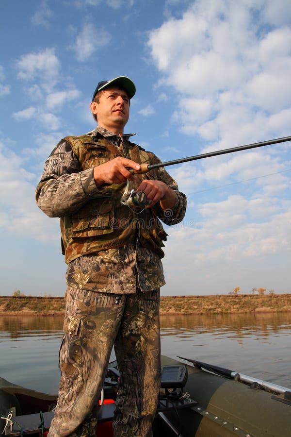 Men fishing with spinning stock photo