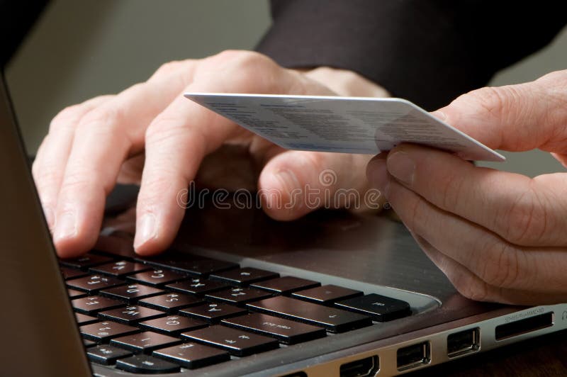 Men hands on keyboard of laptop