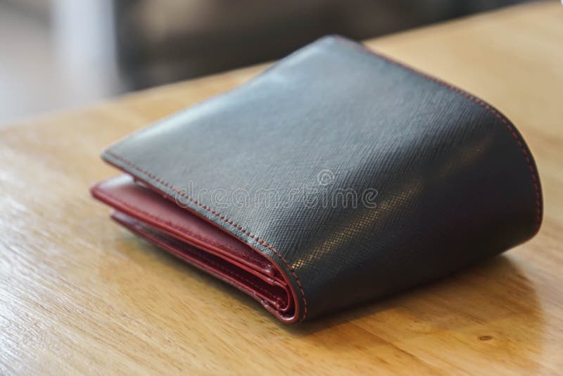 Leather Wallet Close-up On A Brown Wooden Table Stock Image - Image of ...