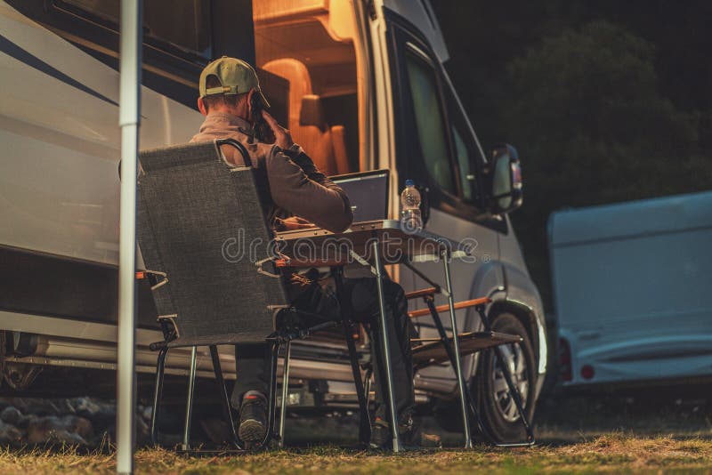 Men Making Business Phone Call While Camper Camping