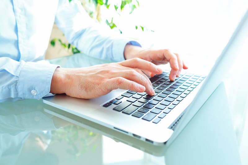 Men office worker typing on the keyboard stock photos Men office worker typing on the keyboard stock photos