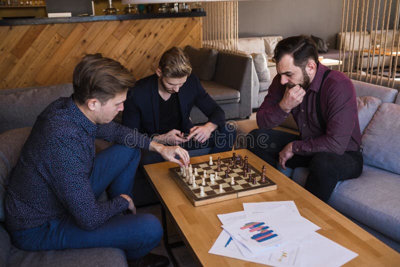 Free Photo  Friends playing chess game