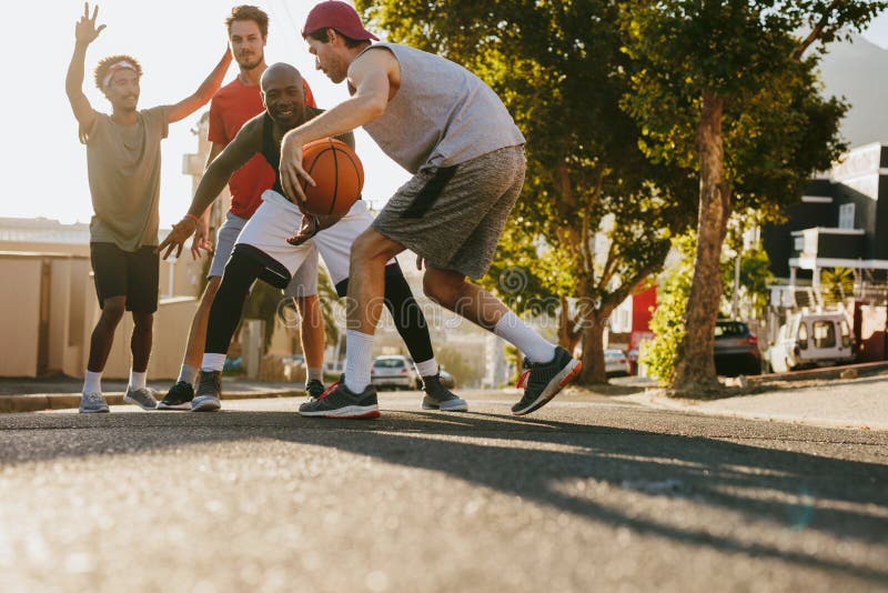 Basketball Guys Walking on Pavement with the Ball Stock Photo - Image ...