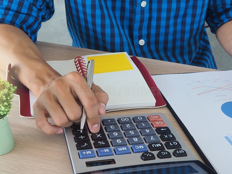 Men are pressing the calculator. Calculate the data. Work in the office concept.
