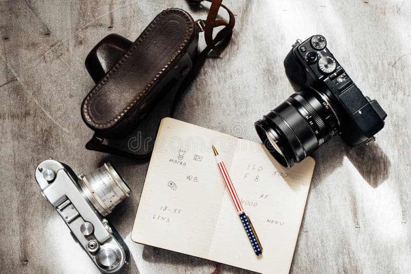 Men s Accessories , top view on a wooden background Retro camera notebook pen