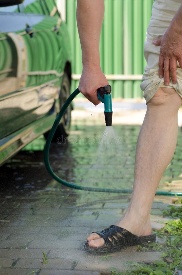Men S Feet are Watered with Water from a Hose Stock Photo Image of