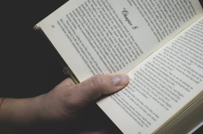 Men& x27;s hand holds an open book ready for reading royalty free stock photos Men& x27;s hand holds an open book ready for reading royalty free stock photos