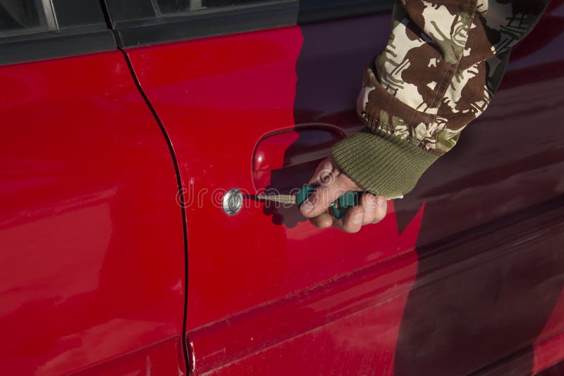 Men`s Hand Puts the Key into the Lock of the Car Stock Photo Image of