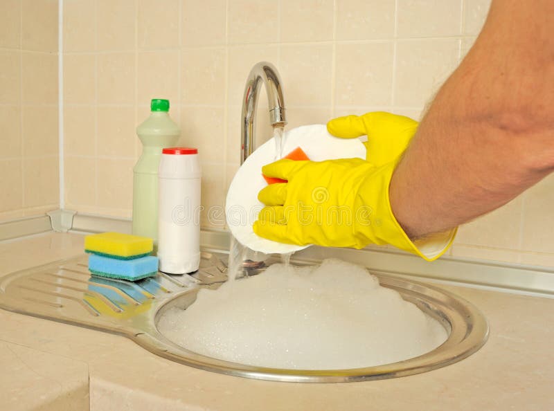 Men s hands washing dish