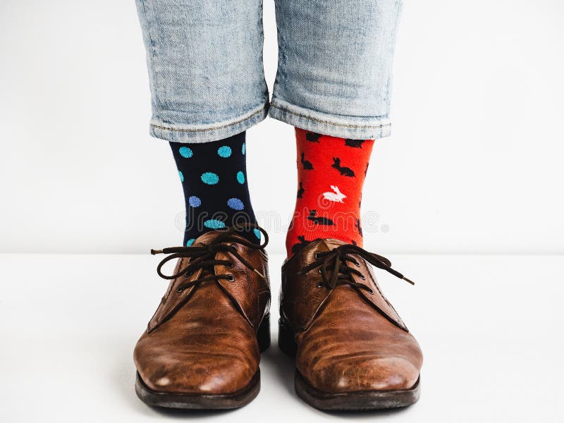 Men`s legs in bright, colorful socks and stylish shoes