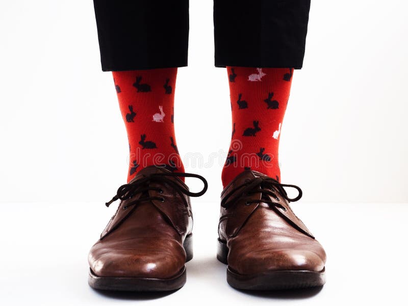 Men`s legs in bright, funny socks