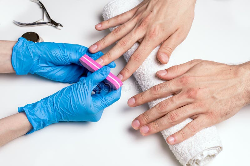 Men`s Manicure. Cosmetologist in Rubber Gloves File Nails on Male Hands.  Stock Photo - Image of clean, fingernail: 118408564
