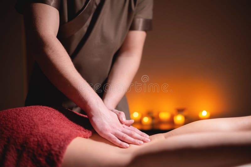 Men`s Premium Luxury Hip Massage Anti-cellulite Wellness Center. Close-up Of A Male Masseur Doing Leg Massage To A