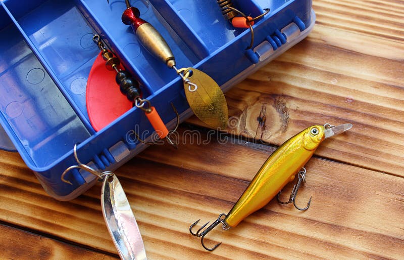 https://thumbs.dreamstime.com/b/men-s-toy-fishing-gear-fishing-hook-tackle-equipment-sport-bait-fish-background-box-catch-reel-hooks-lure-spinning-gear-metal-128471344.jpg