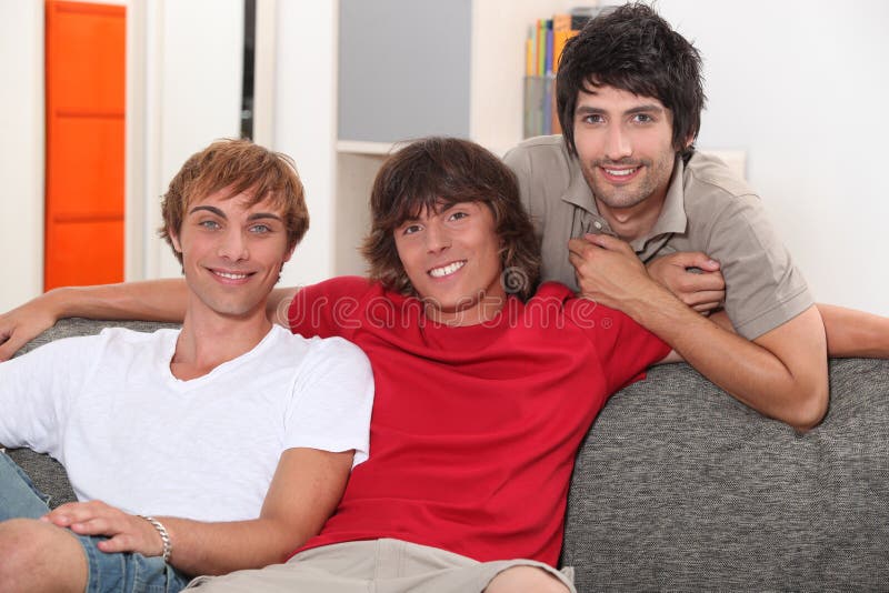 Men on sofa stock image. Image of adults, space, smiling 35507941