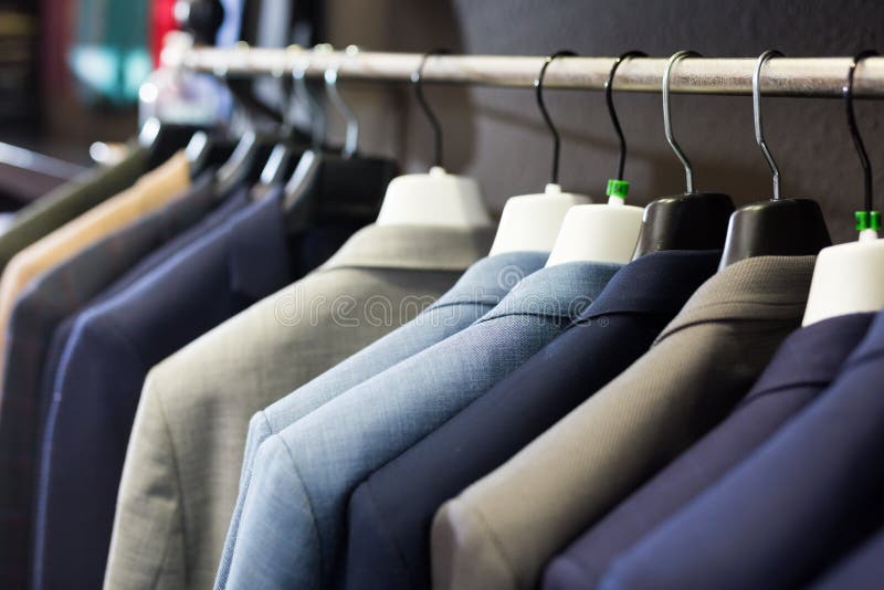 Men Suits on Hanger Racks in Shop Stock Photo - Image of displayed ...