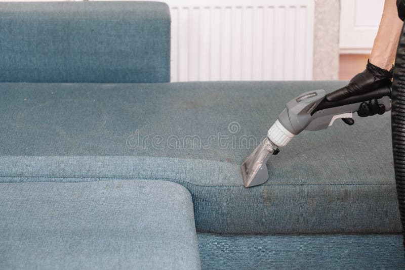 Men Use a Vacuum Cleaner To Clean the Sofa Stock Photo Image of