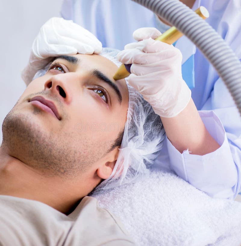 Man Visiting Dermatologyst for Laser Scar Removal Stock Photo Image