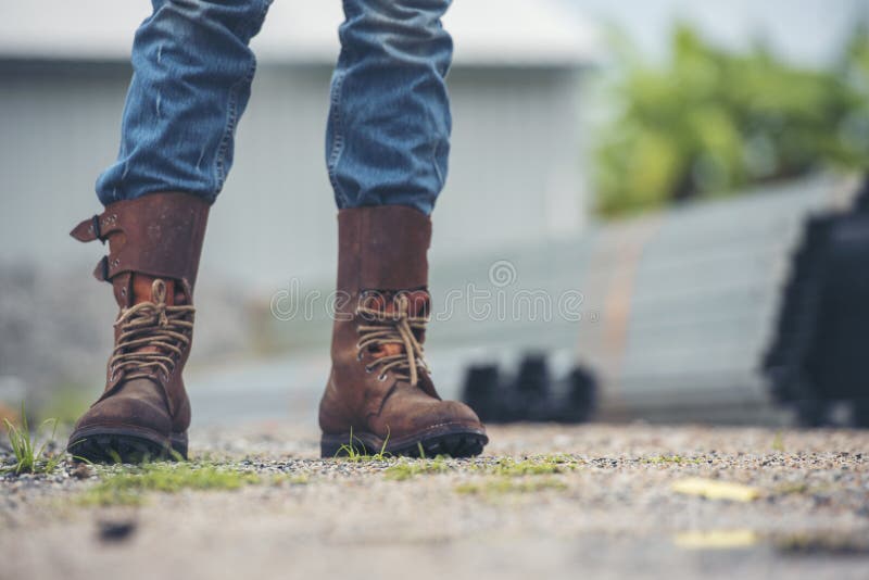 Men Wear Construction Boots Safety Footwear for Worker at Construction  Site. Engineer Wear Jeans Brown Boots Worker on Background Stock Photo -  Image of refinery, contractor: 230703144