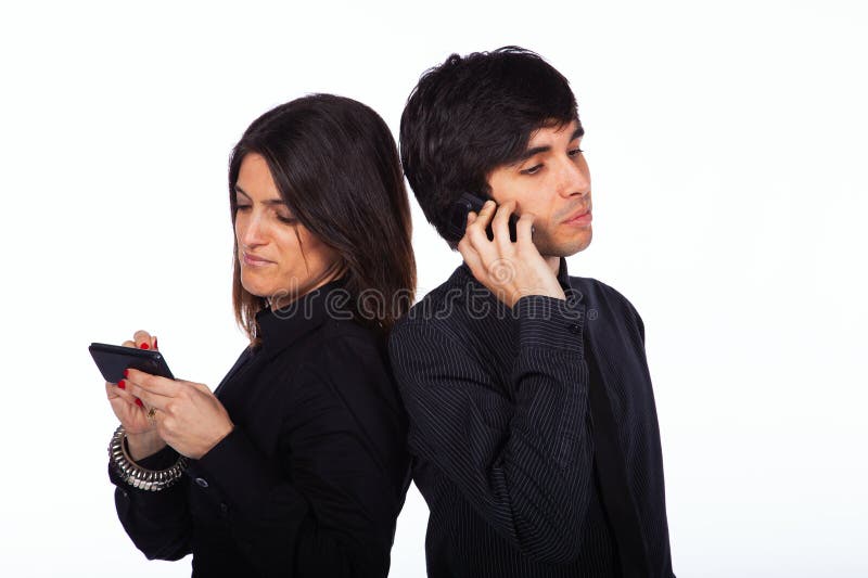 Men and woman talking on the phone stock image