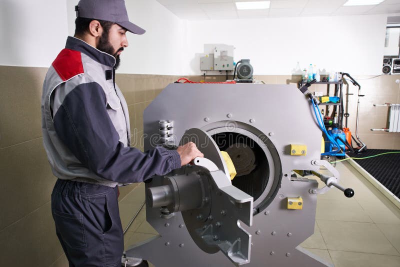 Men Workers Get Carpet from an Automatic Washing Machine and Put in in