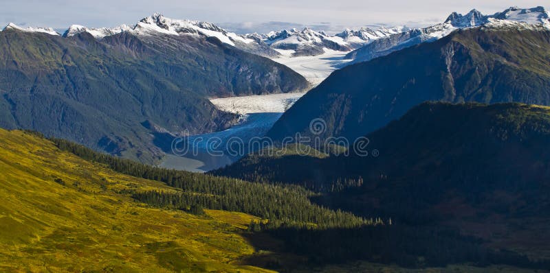 Mendenhall glacier valley. Mendenhall Glacier is a glacier about 13.6 miles long located in Mendenhall Valley, about 12 miles from downtown Juneau in the stock photography Mendenhall glacier valley. Mendenhall Glacier is a glacier about 13.6 miles long located in Mendenhall Valley, about 12 miles from downtown Juneau in the stock photography