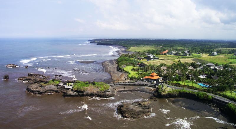 Mengening Beach located in Cemagi village, Mengwi, Badung regency near Tanah Lot Temple just about 60 minutes from Ngurah Rai Airport. As typical in the area of Canggu beach sand black sand beaches, and nearby are filled with rocks, at first glance looks like atmosphere attraction Tanah Lot. Because at this location there is a temple also the Pura Gede Luhur Batungaus located on top of the boulder coral, so it will look more perfect if you are in the east Pura and in moments of sunset, the beauty of sunset integrated perfectly with the existence of the temple on the rock this reef. Mengening Beach located in Cemagi village, Mengwi, Badung regency near Tanah Lot Temple just about 60 minutes from Ngurah Rai Airport. As typical in the area of Canggu beach sand black sand beaches, and nearby are filled with rocks, at first glance looks like atmosphere attraction Tanah Lot. Because at this location there is a temple also the Pura Gede Luhur Batungaus located on top of the boulder coral, so it will look more perfect if you are in the east Pura and in moments of sunset, the beauty of sunset integrated perfectly with the existence of the temple on the rock this reef