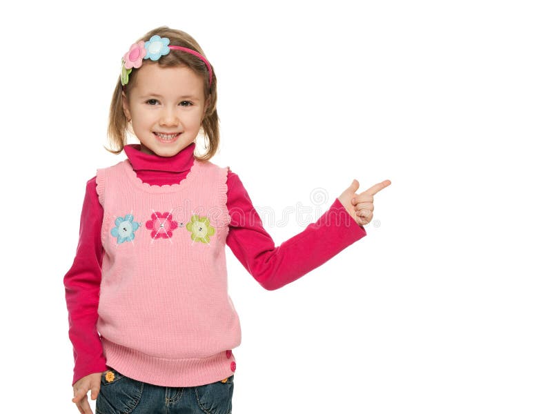 A menina alegre aponta o dedo em algo fotos de stock A menina alegre aponta o dedo em algo fotos de stock