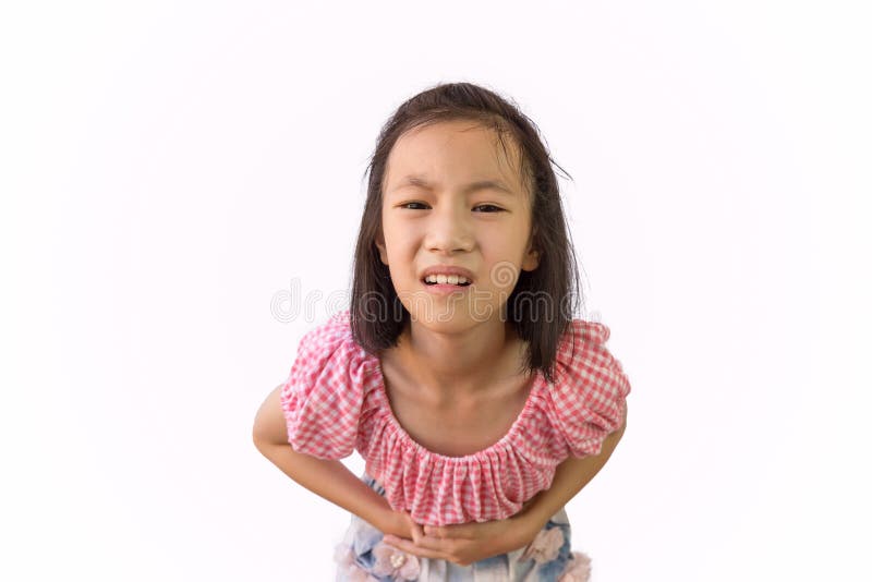 Asian little girl is painful stomach ache isolated on white background, child having food poisoning,Sickness and healthcare concept. Asian little girl is painful stomach ache isolated on white background, child having food poisoning,Sickness and healthcare concept