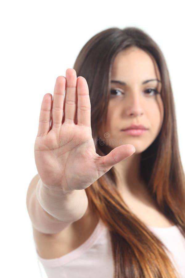 Menina bonita do adolescente que faz o gesto da parada com sua mão fotos de stock Menina bonita do adolescente que faz o gesto da parada com sua mão fotos de stock