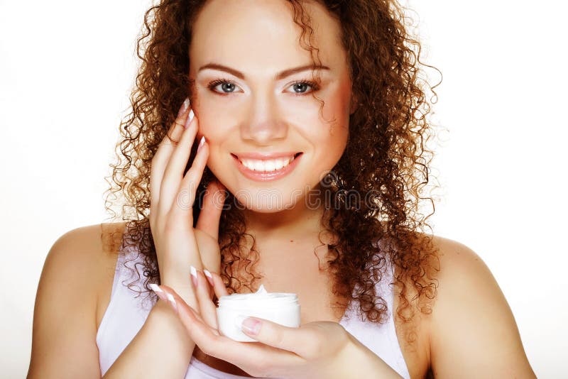 Menina bonita dos termas que guarda o frasco do creme imagem de stock Menina bonita dos termas que guarda o frasco do creme imagem de stock