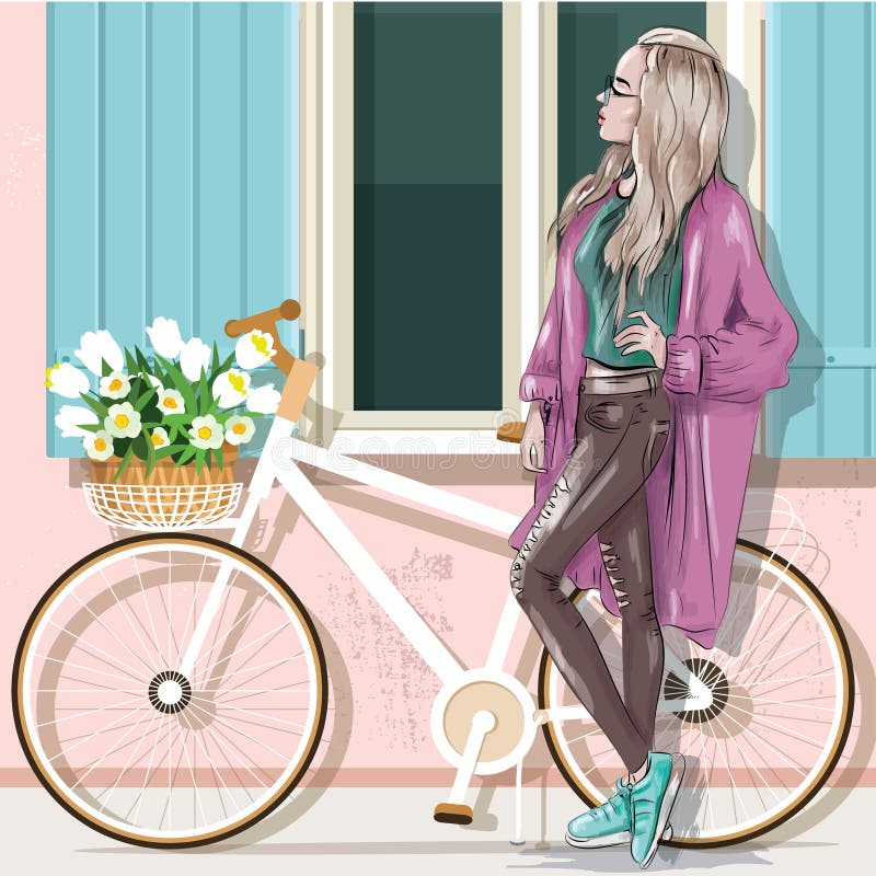 Menina bonita na roupa ocasional com a fachada da bicicleta e da construção