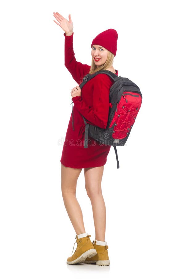 A menina bonita no vestido vermelho e na trouxa isolados no branco imagem de stock A menina bonita no vestido vermelho e na trouxa isolados no branco imagem de stock