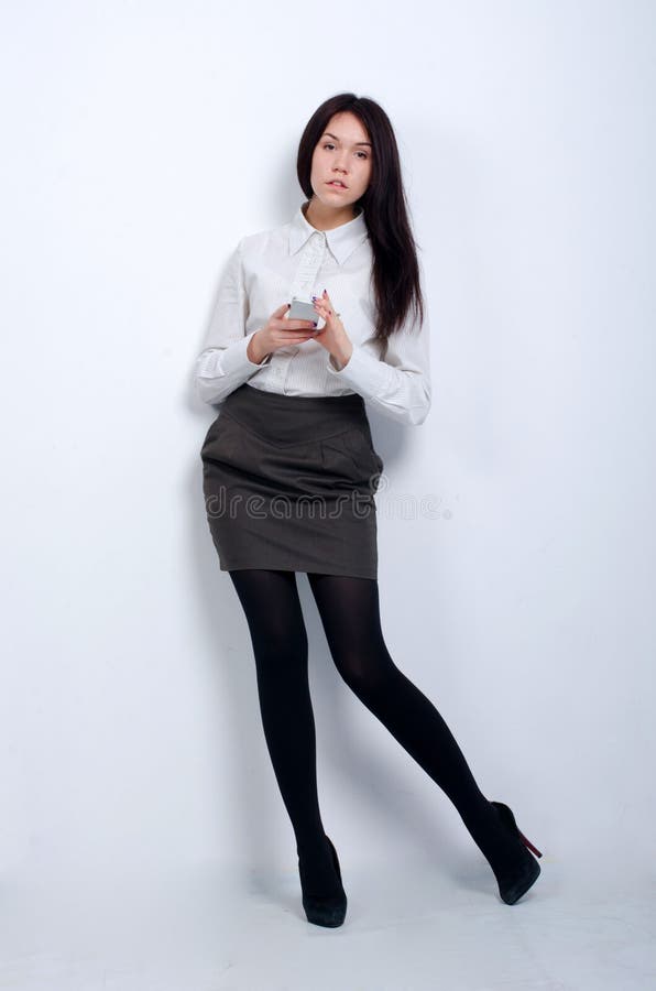 Jovem rapariga bonita com equipamento de escritório fotos de stock royalty free