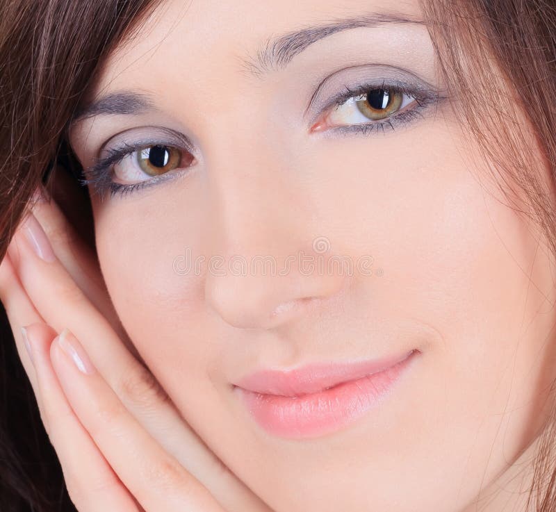 Menina bonita que toca em sua cara imagens de stock Menina bonita que toca em sua cara imagens de stock