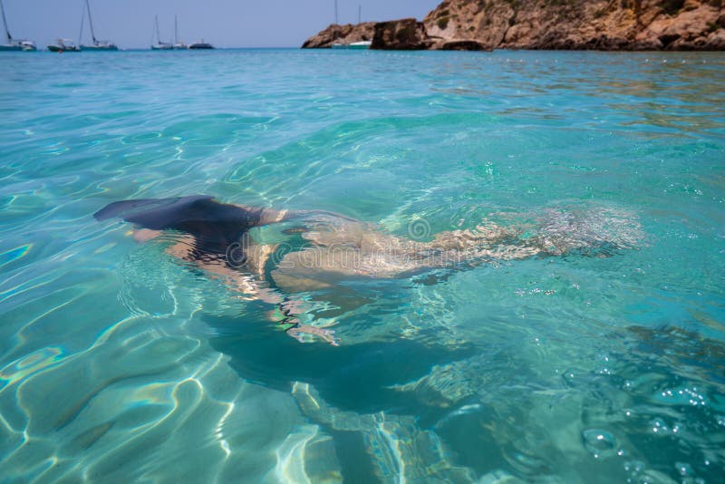 Ibiza bikini girl swimming clear water beach of Balearic Islands. Ibiza bikini girl swimming clear water beach of Balearic Islands