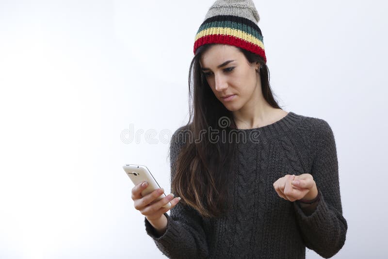 Menina do moderno e sms tristes imagens de stock royalty free Menina do moderno e sms tristes imagens de stock royalty free