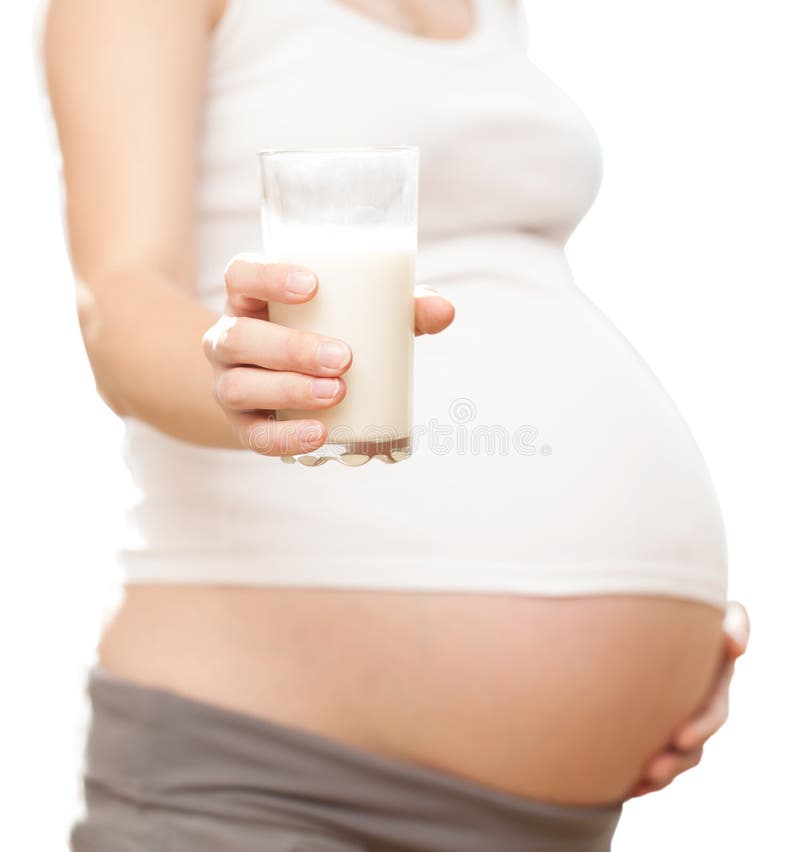 Rapariga grávida e leite imagens de stock