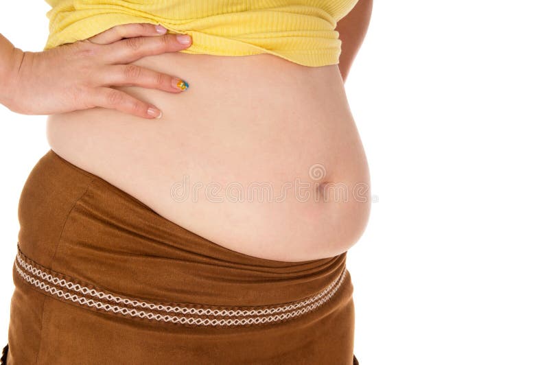 Girl shows off her belly isolated on white background. Girl shows off her belly isolated on white background