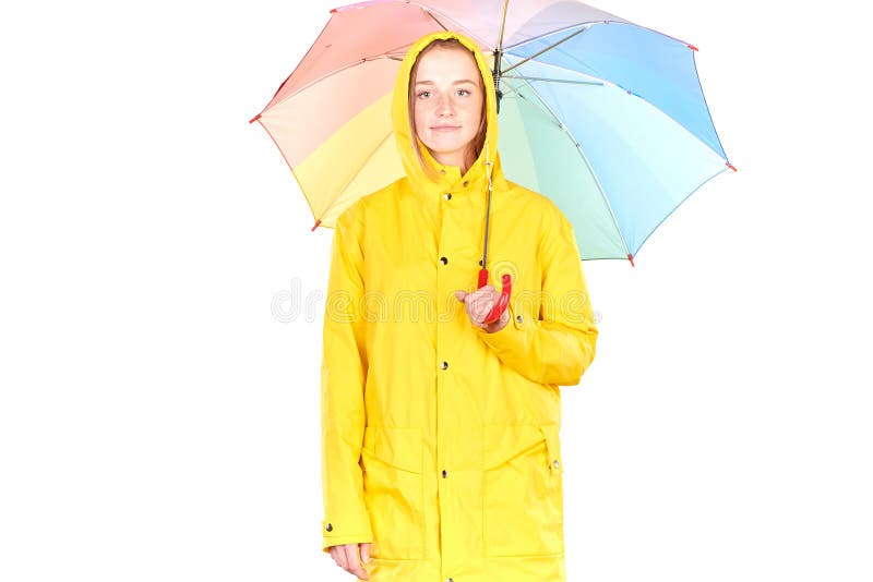 Menina na capa de chuva amarela imagens de stock Menina na capa de chuva amarela imagens de stock