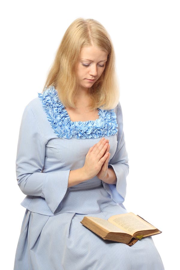 Menina Praying com uma Bíblia foto de stock royalty free Menina Praying com uma Bíblia foto de stock royalty free